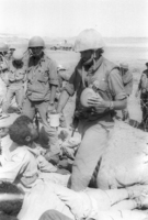 IDF Soldiers giving drinking water to the Egyptian POW's.