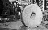 The Yemin Moshe Quarter in Jerusalem with the hudge old millstone.