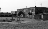 Photograph of: Jewish shops near the building of the city adinistration.