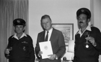 Niels Hansen, Ambassador of Germany to Israel presenting his country medal to two Israeli policemen for bravery.