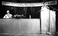 Defence Minister Moshe Dayan listening to questions at an assemly for youths graduates of the High Schools in Israel which took place at the Mann Auditorium in Tel Aviv.