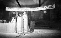 Defence Minister Moshe Dayan listening to questions at an assemly for youths graduates of the High Schools in Israel which took place at the Mann Auditorium in Tel Aviv.