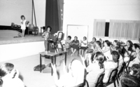 New immigrants participating on a free day leaarning the Hebrew songs.