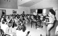New immigrants participating on a free day leaarning the Hebrew songs.