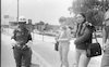 Soldiers waiting for a ride while Military Police woman is guarding for their safety – הספרייה הלאומית