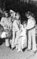 Children collecting dresses to distribute to poor families.