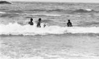 In spite of the sign saying that it danger and no bathing at the spot, dozens are using the dangerous seashore.