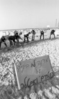 Members of Young Mapam Party, demonstrating on a Tel Aviv beach against the government's economic policy, which they say, will create unemloyment.