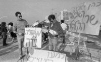Members of Young Mapam Party, demonstrating on a Tel Aviv beach against the government's economic policy, which they say, will create unemloyment.