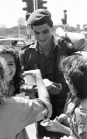 The Scouts movement sent their members to hand out to soldiers, apples and honey for Rosh Hashanah evening at intersections where soldiers are waiting for rides.