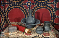 Photograph of: Torah Ark curtain, Mikveh vessel, Box, Ethrog container, Laver and basin, Esther scroll case.